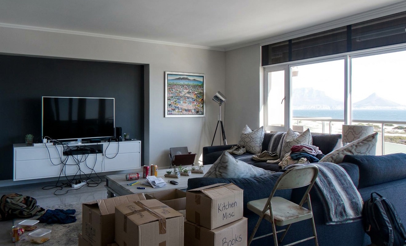 Messy agent upload lounge before and after virtual staging — original
